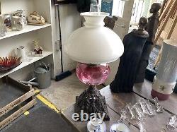 A Beautiful Antique Art Nouveau Oil Lamp With Cranberry Glass Shade. 22 High