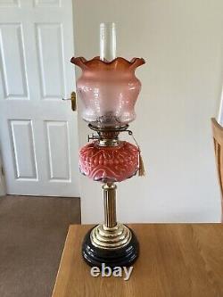 A Colourful Antique Oil Lamp Complete With Original Shade