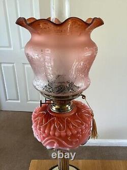A Colourful Antique Oil Lamp Complete With Original Shade