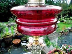 A Good Quality Ruby Victorian Corinthian Column Twin Duplex Table Oil Lamp