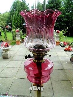 A Good Quality Victorian Cranberry Twin Duplex Oil Lamp