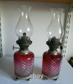 A Pair Of Victorian Cranberry Glass Table Oil Lamps