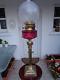 A Quality 30 Tall Victorian Cranberry Corinthian Column Twin Duplex Oil Lamp