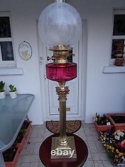 A Quality 30 Tall Victorian Cranberry Corinthian Column Twin Duplex Oil Lamp