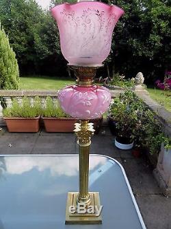 A Superb Quality Cranberry Victorian Twin Duplex Oil Lamp With Original Shade