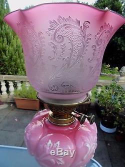 A Superb Quality Cranberry Victorian Twin Duplex Oil Lamp With Original Shade