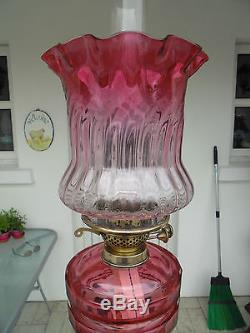 A Superb Victorian Cranberry Twin Duplex Oil Lamp
