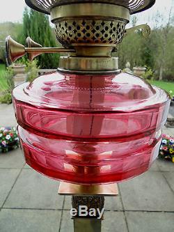 A Superb Victorian Cranberry Twin Duplex Oil Lamp