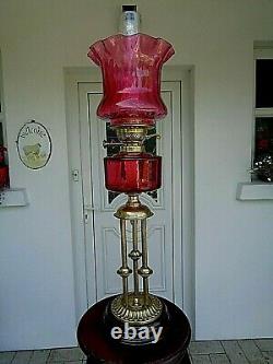A Superb Victorian Style Ruby Three Column 26.1/2 Tall Twin Duplex Oil Lamp