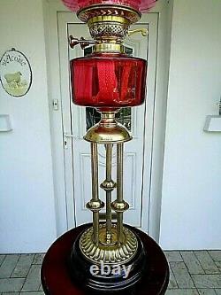 A Superb Victorian Style Ruby Three Column 26.1/2 Tall Twin Duplex Oil Lamp