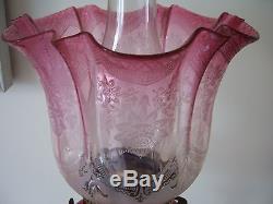 A Tall Victorian Cranberry Glass Oil Lamp And Shade With Brass Column Base