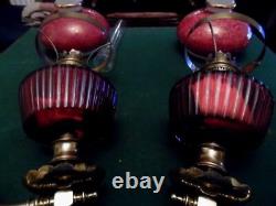 A pair of victorian oil lamps and shades