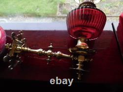 A pair of victorian oil lamps and shades