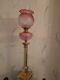 A stunning cranberry victorian oil lamp