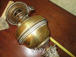 An antique brass Corinthian column oil lamp