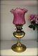 Antique Victorian Brass Oil Lamp with Cranberry Coloured Glass Shade