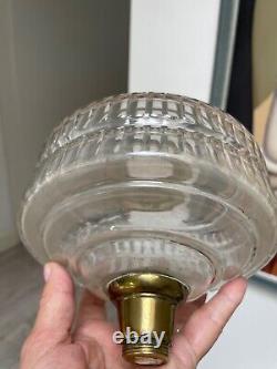 Antique bras art nouveau oil lamp with a facet cut clear font and duplex burner