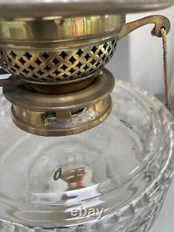 Antique bras art nouveau oil lamp with a facet cut clear font and duplex burner