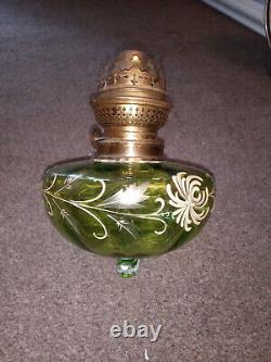 Antique hanging oil lamp. Green glass with gold detail. Brass frame