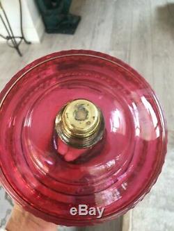 Antique large cranberry facet cut tiered oil lamp