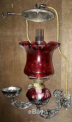 Antique pair showman cranberry oil lamp