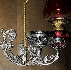Antique pair showman cranberry oil lamp