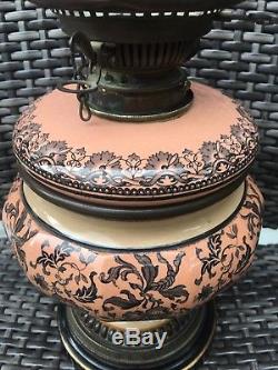 Antique pink and black foliate ceramic hinks oil lamp