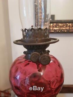 Beautiful tall brass and cranberry glass oil lamp