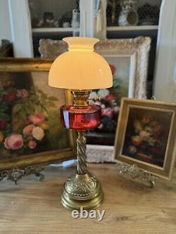 Converted Embossed Brass Oil Lamp with Cranberry Glass Reservoir