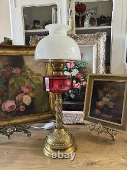 Converted Embossed Brass Oil Lamp with Cranberry Glass Reservoir