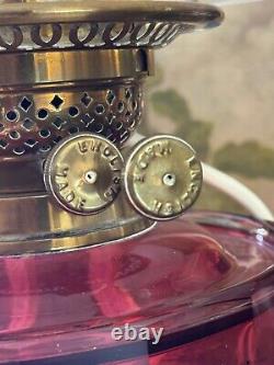 Converted Embossed Brass Oil Lamp with Cranberry Glass Reservoir