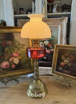 Converted Embossed Brass Oil Lamp with Cranberry Glass Reservoir