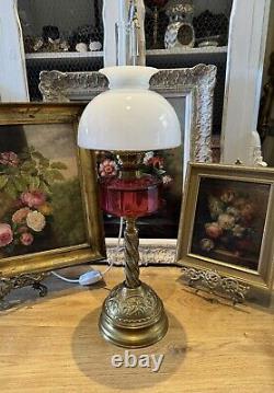 Converted Embossed Brass Oil Lamp with Cranberry Glass Reservoir