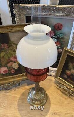 Converted Embossed Brass Oil Lamp with Cranberry Glass Reservoir