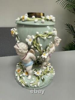 Green Sitzendorf porcelain oil lamp, 19th century. Cherubs putti