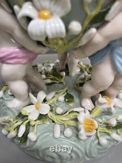 Green Sitzendorf porcelain oil lamp, 19th century. Cherubs putti