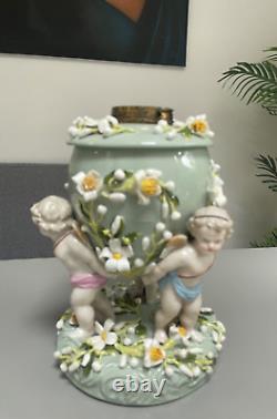 Green Sitzendorf porcelain oil lamp, 19th century. Cherubs putti