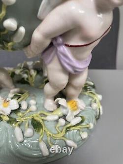 Green Sitzendorf porcelain oil lamp, 19th century. Cherubs putti