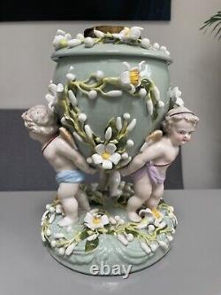 Green Sitzendorf porcelain oil lamp, 19th century. Cherubs putti