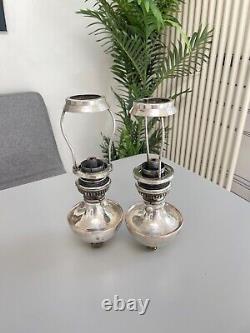 Pair of Benson silver plate peg fonts and shade carrier