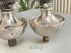 Pair of Benson silver plate peg fonts and shade carrier