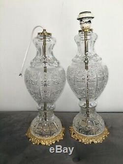 Pair of large antique cut glass table lamps with gilded brass fretwork bases