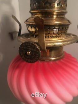 Pink wrythen moulded satin twist peg oil lamp brass base zimmerman & co