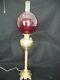 Rochester brass oil lamp 37in banquet style electrified w ruby red optic globe