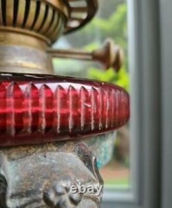 Solid Bronze Victorian Oil Lamp with Lions Heads Paw Feet Cranberry Cut Glass