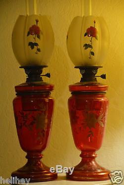 Superb pair of Victorian /Bohemian hand painted /gilded Cranberry oil lamp