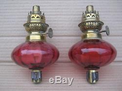 Superb pair of antique Victorian cranberry glass peg/piano oil lamps