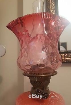 Tall cranberry glass duplex oil lamp