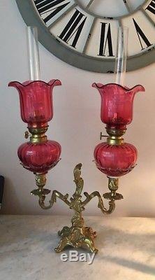 Victorian antique double cranberry glass and brass oil lamp