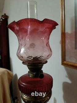 Victorian banqueting oil lamp with cranberry shades